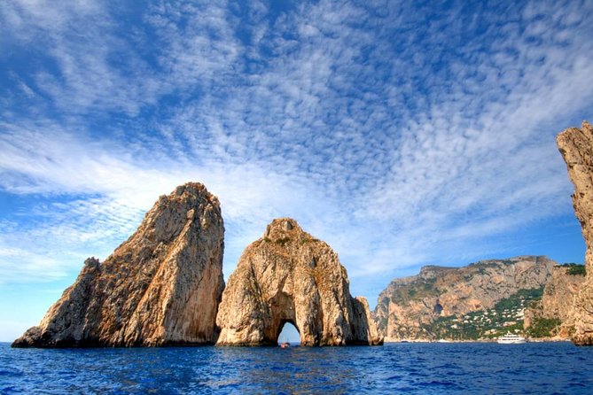Capri Island Small Group Boat Tour from Rome by Train - Capri from the water: grottos, cliffs, and famous stone