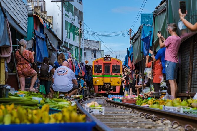 Damnoen Saduak Floating Market and Maeklong Railway Market Tour - Wat Bang Kung and the banyan-root chapel