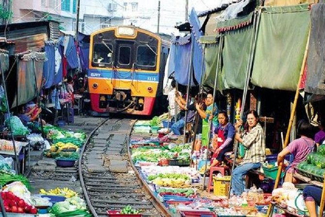 Floating Market Damnoen Saduak and Meklong Railway Market: Half Day Tour - Walking the canal banks after the boat ride