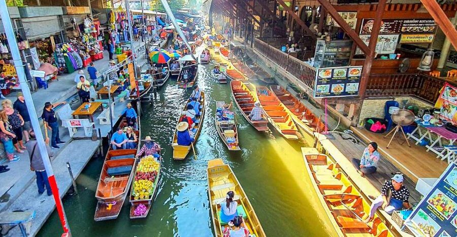 From Bangkok: Damnoen Saduak & Train Market Tour in Spanish - Damnoen Saduak by longtail boat