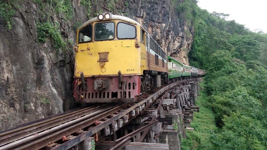 From Bangkok: Kanchanaburi War Cemetery and Death Railway.. - Walking across the Bridge Over the River Kwai