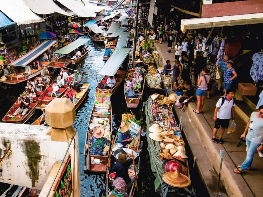 From Bangkok: Maeklong Railway and Floating Market Day Tour - Cruising toward Damnoen Saduak by longtail boat