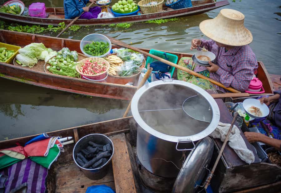 From Bangkok: Maeklong Railway and Floating Market Food Tour - Mae Klong Railway Market and the train that cuts through it