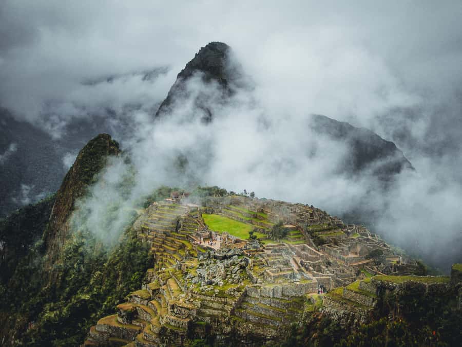 From Cusco: 2-Day Sacred Valley and Machupicchu by Train - Pisac ruins and the market below
