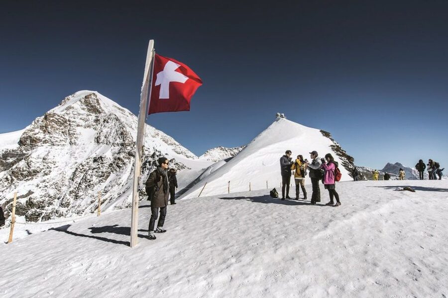 From Interlaken: Guided Tour to Jungfraujoch - Top of Europe - The Plateau and the famous Swiss flag