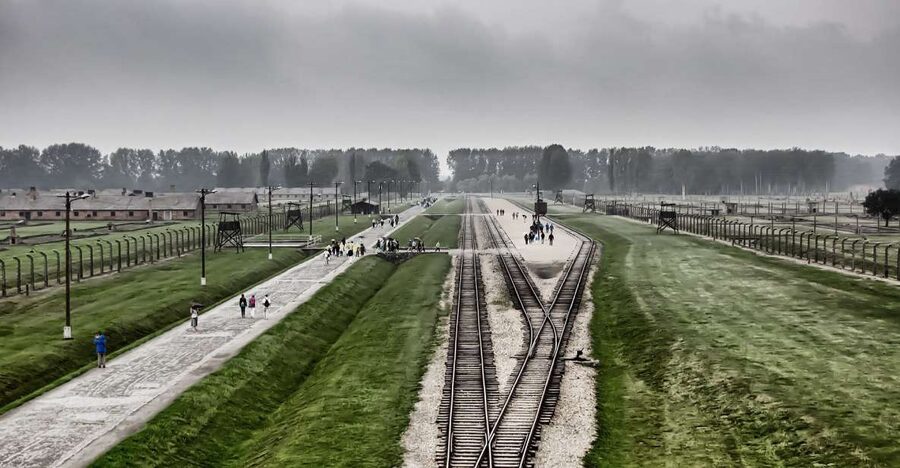 From Warsaw: Auschwitz-Birkenau Guided Tour with Fast Train - Walking through Auschwitz II-Birkenau