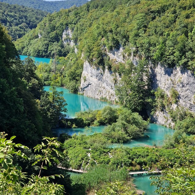 From Zadar: Plitvice Lakes Guided Tour with Boat & Train - How the Guide Adds Value