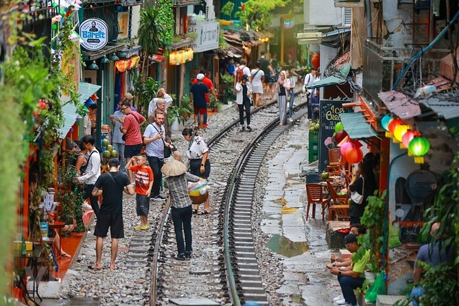 Hanoi Vespa After Dark Street food + Train Street+ Live Music - Walking beside Train Street with egg coffee