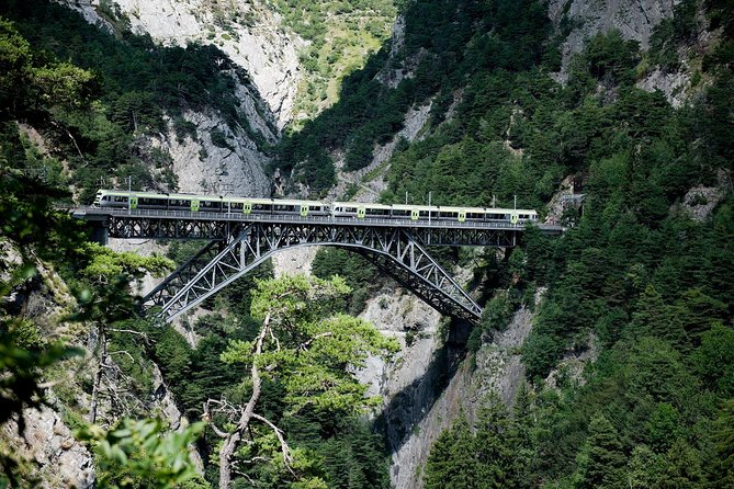 Interlaken and the Green Train of Swiss Alps Day Trip from Milan - Lake Thun by boat, with the famous peaks ahead