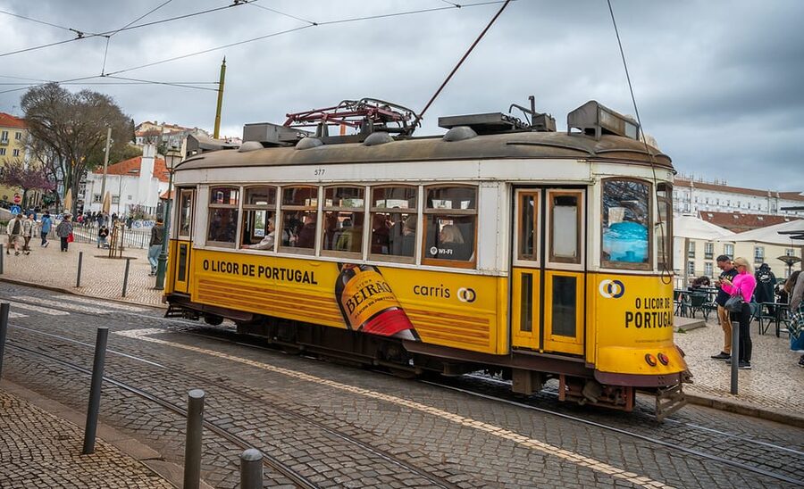 Lisbon: Tram 28 Entry Ticket & Audio Guide with 24-Hour Pass - Alfama: ride first, walk second