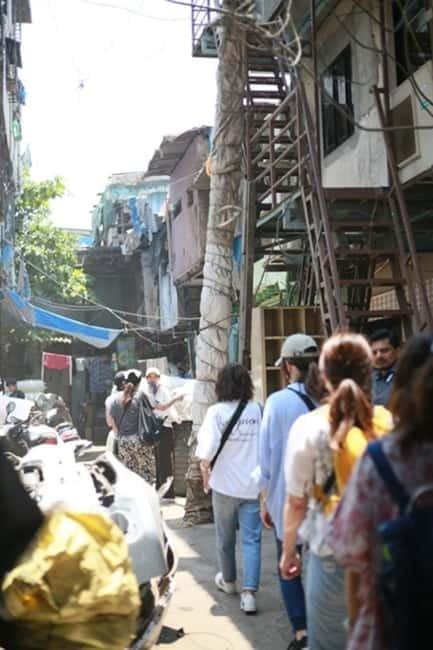 Mumbai: Dharavi Slum and Dhobi Ghat Tour with Train Ride - Walking through Dharavi’s working lanes