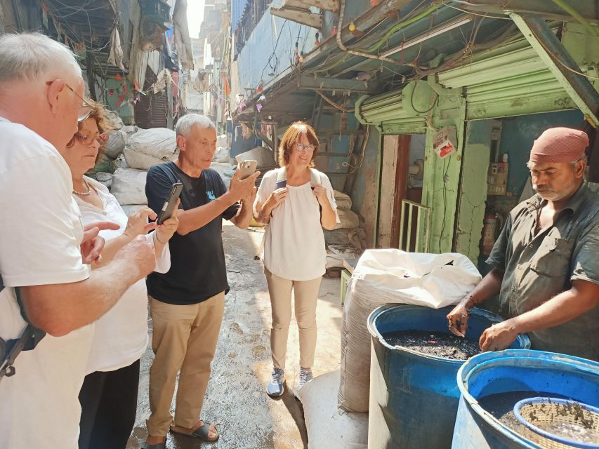 Mumbai: Dharavi Slum and Dhobi Ghat Tour with Train Ride - Dhobi Ghat: Mumbai’s laundry at ground level