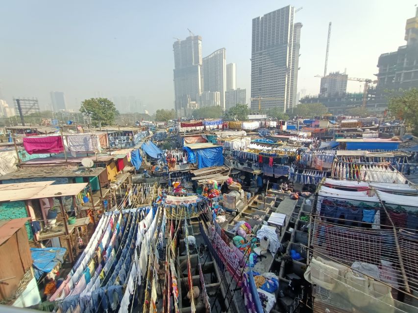 Mumbai: Dhobi Ghat Tour with Dharavi and Train Ride Options - Why Dhobi Ghat tells you more than a photo stop