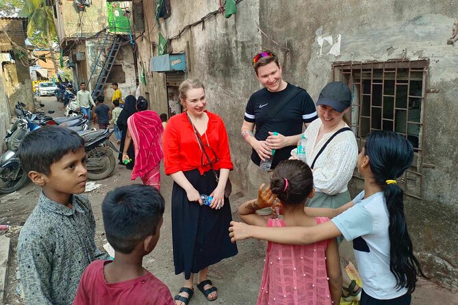 Mumbai Slum Tour with Dhobi Ghat Laundry & Train Ride Tour - Price, group size, and what the fee covers