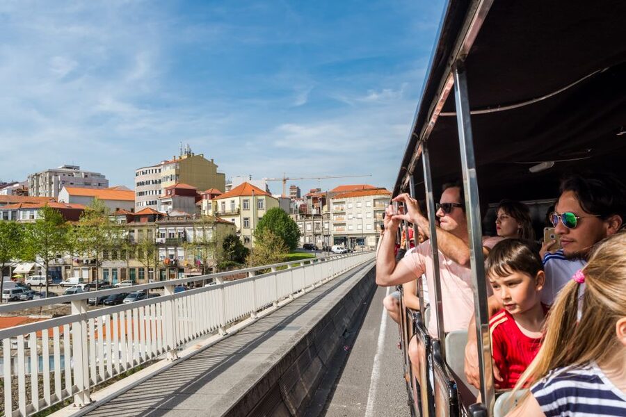 Porto: City Train Tour, River Cruise & Wine Cellar - Riding Porto’s steep streets by train