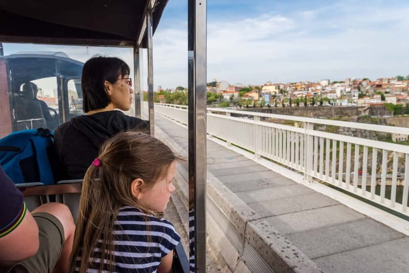 Porto: Magic Train Tour and Port Wine Cellar with Tastings - Clérigos Tower, Carmelite churches, and Porto’s bookshop district