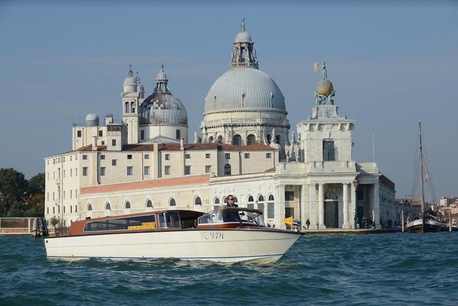 Private Arrival Transfer: Venice Train or Bus Stations to Venice Hotels - Arriving at Santa Lucia Station with a water taxi ahead