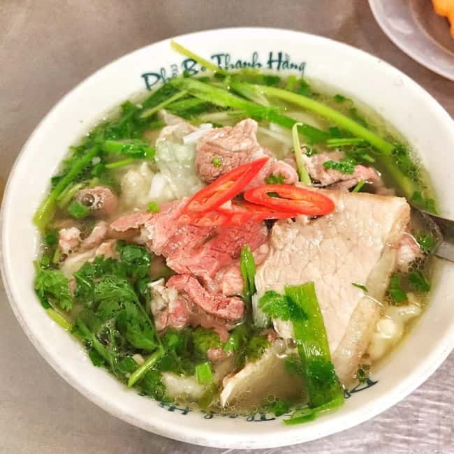 Private Half-Day Hanoi City Tour with Cyclo and Train street - Dong Xuan Market and the commercial heart of the Old Quarter