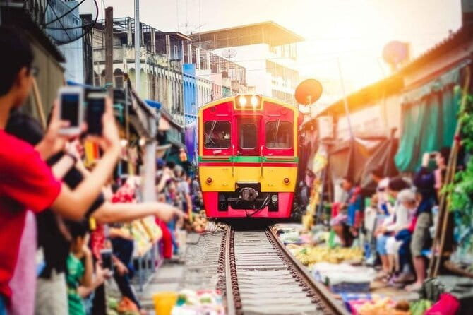 Private Tour to Maeklong Train Market and Floating Market - A train crossing the middle of Maeklong Market