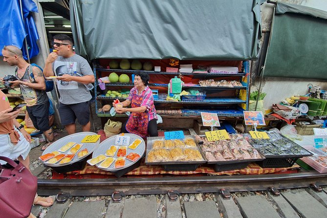 Train & Floating Market Food Adventure + Scenic train ride - Damnoen Saduak by boat