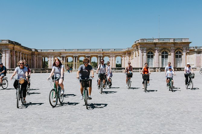 Versailles Domain Bike Tour with Palace Entry by Train from Paris - The formal gardens and Grand Canal