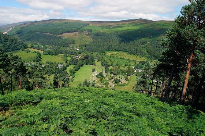 Wicklow Mountains, Avoca and Glendalough Rail Tour from Dublin - Glendalough’s lakes, ruins, and round tower